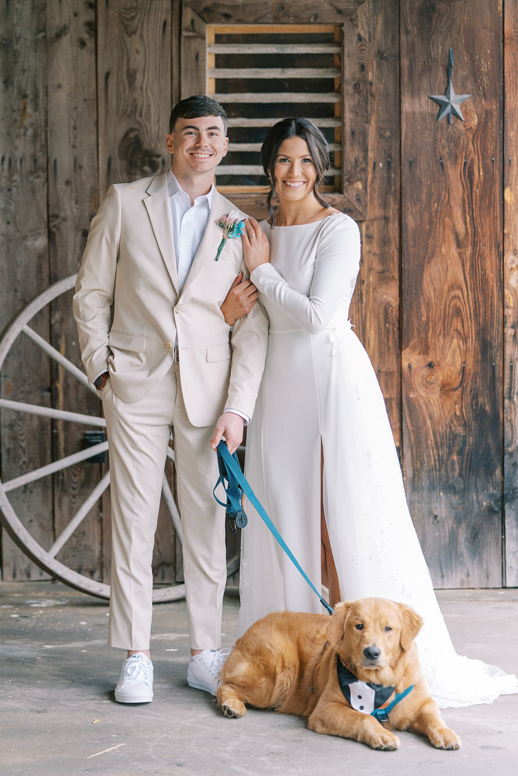 bride and groom with their dog at wind in the willows wedding venue